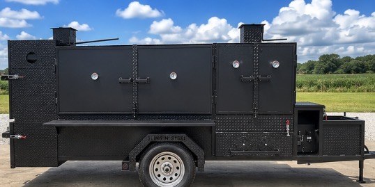 Full side profile of the trailer smoker
